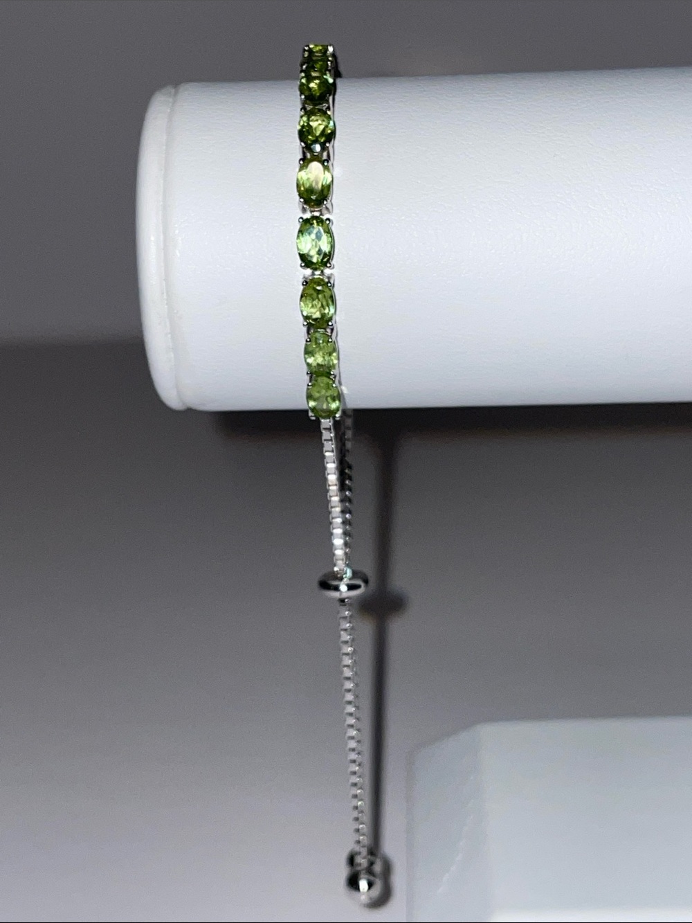 Peridot Tennis Bracelet In Rhodium Plate Sterling Silver With Adj. Bolo Clasp